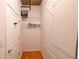 Walk-in closet with installed wire shelving and wood floor at 923 Peachtree Ne St # 932, Atlanta, GA 30309