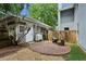 Charming backyard patio with brick flooring and a cozy seating area, surrounded by greenery and fence at 996 Blue Ridge Ne Ave, Atlanta, GA 30306