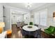 Open-concept dining room leading to a kitchen, featuring ample light and hardwood floors at 996 Blue Ridge Ne Ave, Atlanta, GA 30306