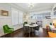 Dining room featuring natural light, wainscoting, hardwood floors and modern lighting at 996 Blue Ridge Ne Ave, Atlanta, GA 30306