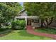 Charming home with a brick walkway leading to the front door and lush landscaping at 996 Blue Ridge Ne Ave, Atlanta, GA 30306