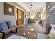 Relaxing front porch with seating, a swing, tiled flooring, and exposed brick at 996 Blue Ridge Ne Ave, Atlanta, GA 30306