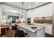 Modern kitchen with stainless steel appliances, a large granite island, and bright cabinets at 996 Blue Ridge Ne Ave, Atlanta, GA 30306