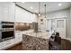 Modern kitchen with stainless steel appliances, granite countertops, and pendant lighting over the island at 996 Blue Ridge Ne Ave, Atlanta, GA 30306