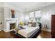 Cozy main bedroom with a decorative fireplace, hardwood floors and great natural light at 996 Blue Ridge Ne Ave, Atlanta, GA 30306