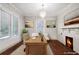 Home office with natural light, hardwood floors, fireplace and classic chandelier at 996 Blue Ridge Ne Ave, Atlanta, GA 30306