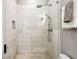 Bright bathroom featuring a glass enclosed shower, white tile, and neutral accents at 996 Blue Ridge Ne Ave, Atlanta, GA 30306