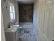 Bathroom featuring a slate tile shower and marble floors at 1920 Moores Mill Nw Rd, Atlanta, GA 30318