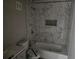 The renovated bathroom features marble tiling in the shower at 1920 Moores Mill Nw Rd, Atlanta, GA 30318