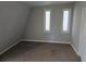 Bedroom with two windows, and neutral decor, providing a tranquil retreat at 1920 Moores Mill Nw Rd, Atlanta, GA 30318