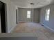 Large bedroom featuring two windows and underlayment at 1920 Moores Mill Nw Rd, Atlanta, GA 30318
