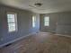 Empty game room features natural light and a neutral color palette awaiting transformation at 1920 Moores Mill Nw Rd, Atlanta, GA 30318