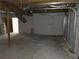 Unfinished garage with concrete floors, door, and exposed utilities, awaiting customization at 1920 Moores Mill Nw Rd, Atlanta, GA 30318