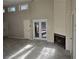 Bright living room features a stone fireplace, and ample natural light at 1920 Moores Mill Nw Rd, Atlanta, GA 30318