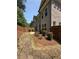 Backyard stone walkway with privacy fence and manicured bushes at 2021 Towneship Trl, Roswell, GA 30075