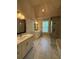 Bright bathroom with double vanities, a glass-enclosed shower, and marble flooring at 2021 Towneship Trl, Roswell, GA 30075