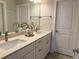 Bright bathroom featuring a double vanity with stone countertop and modern fixtures, offering a clean, contemporary design at 2021 Towneship Trl, Roswell, GA 30075