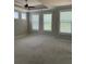 Bedroom with neutral paint, a ceiling fan, and many windows at 2021 Towneship Trl, Roswell, GA 30075