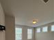 A comfortable bedroom is bathed in natural light from multiple windows, creating a serene atmosphere at 2021 Towneship Trl, Roswell, GA 30075