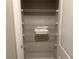 A well-organized linen closet features wire shelving and towels, offering practical storage at 2021 Towneship Trl, Roswell, GA 30075