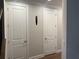 Hallway with storage closet offering a simple place to store everyday items at 2021 Towneship Trl, Roswell, GA 30075