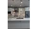Bright kitchen featuring white cabinets, stainless steel appliances, and a large island with countertop seating at 2021 Towneship Trl, Roswell, GA 30075