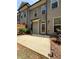 A concrete patio outside a door to a grey house at 2021 Towneship Trl, Roswell, GA 30075