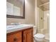 Bathroom featuring wood vanity, large mirror and a shower/tub combo with a built in seat at 3003 Landmark Dr, Conyers, GA 30094