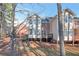 Exterior of a multi-level home with a wooded backyard and a small deck at 572 Vinings Estates Se Dr # B9, Mableton, GA 30126