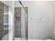 Tiled shower with glass door, and mounted shower head at 572 Vinings Estates Se Dr # B9, Mableton, GA 30126