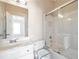 Bright bathroom features a shower over tub with sliding glass doors and a single sink vanity at 572 Vinings Estates Se Dr # B9, Mableton, GA 30126