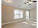 Bedroom with neutral carpet, natural light, ceiling fan and ensuite bathroom at 572 Vinings Estates Se Dr # B9, Mableton, GA 30126