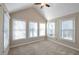 Bedroom with neutral carpet, vaulted ceiling, ceiling fan, and lots of natural light at 572 Vinings Estates Se Dr # B9, Mableton, GA 30126