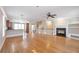 Spacious open-concept living area with hardwood floors, fireplace, and staircase at 572 Vinings Estates Se Dr # B9, Mableton, GA 30126