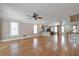 Spacious living area showcasing hardwood floors, ceiling fan, and an open layout with lots of natural light at 572 Vinings Estates Se Dr # B9, Mableton, GA 30126