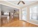 Open-concept living room featuring hardwood floors, a ceiling fan, and access to other living spaces at 572 Vinings Estates Se Dr # B9, Mableton, GA 30126