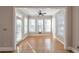 Cozy sunroom with many windows, a ceiling fan, and hardwood floors at 572 Vinings Estates Se Dr # B9, Mableton, GA 30126