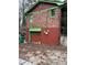 View of a two-story brick building with a garage and green trim at 2765 Rollingwood Se Ln, Atlanta, GA 30316