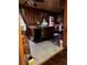 Rustic kitchen with wood paneling, tiled floor, and classic cabinetry at 2765 Rollingwood Se Ln, Atlanta, GA 30316