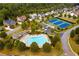 Aerial shot of community pool and tennis courts nestled among trees and beautiful homes in this vibrant neighborhood at 2820 Garonne Way, Cumming, GA 30041