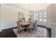 Elegant dining room featuring an elegant chandelier, and windows with shutters at 2820 Garonne Way, Cumming, GA 30041