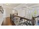 Bright foyer featuring coffered ceilings, hardwood floors, and large windows offering scenic views at 2820 Garonne Way, Cumming, GA 30041