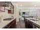 Elegant kitchen with stone backsplash, marble countertops, and stainless steel appliances at 2820 Garonne Way, Cumming, GA 30041
