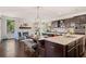 Spacious kitchen and living space with custom center island and eat-in dining at 2820 Garonne Way, Cumming, GA 30041