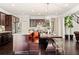 Full kitchen features dark wood cabinetry and stainless steel appliances at 2820 Garonne Way, Cumming, GA 30041