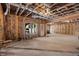 Spacious unfinished basement with exposed framework and a window presents a blank canvas for customization at 2820 Garonne Way, Cumming, GA 30041