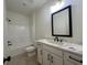 Bathroom with tub, toilet, vanity, white marble counters, and black hardware at 34 Harmony Ridge Dr, Temple, GA 30179