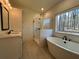 Bright bathroom featuring a shower, soaking tub and modern vanity at 34 Harmony Ridge Dr, Temple, GA 30179
