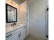 Bright bathroom featuring a modern vanity with drawers and cabinets, lighting, and mirror at 34 Harmony Ridge Dr, Temple, GA 30179