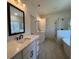 Contemporary bathroom featuring double vanities, soaking tub, and tiled shower with glass door at 34 Harmony Ridge Dr, Temple, GA 30179